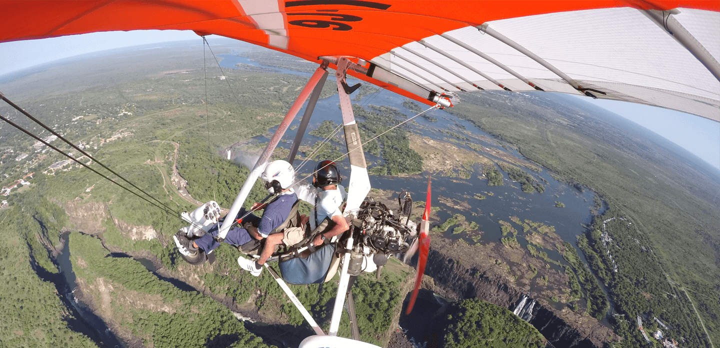 Soaring over the victoria falls, africa’s largest falls, in a hang glider with a motorised engine and seating area. The ultimate experience if you ask us
